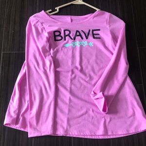 A purple Long T shit with a Word BRAVE on it